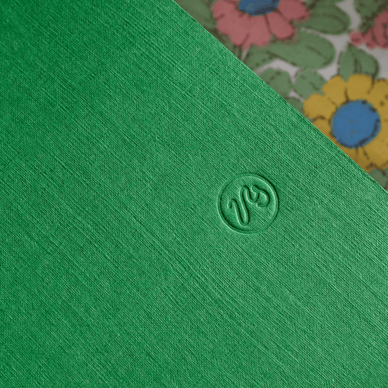 Embossed Papersmiths logo on linen